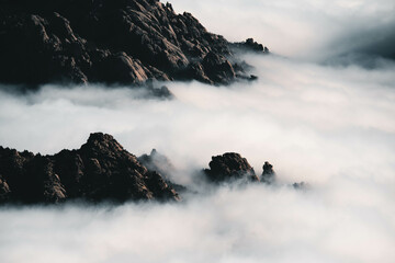 Beautiful mountains under a sea of ​​clouds during a cloudy day