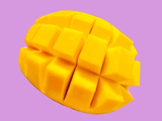 Mango summer fruit on purple background 