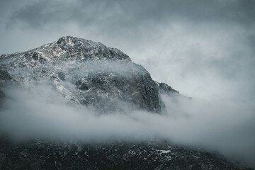 Beautiful mountains under a sea of ​​clouds during a cloudy day