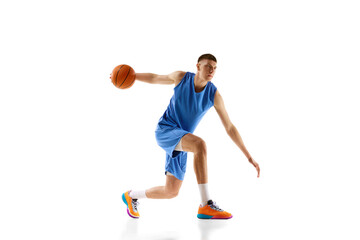 Dynamic image of young man in blue uniform, basketball player in motion during game, dribbling ball...