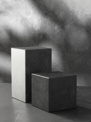 Two modern black cuboid stone rock podium, geometric pedestal on gray counter. Luxury cosmetic,...