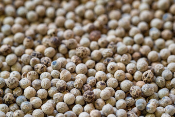 Close-up of a pile of white peppercorns
