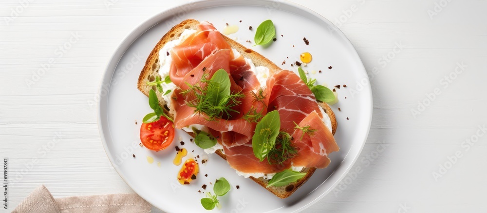 Poster breakfast or brunch open sandwich with prosciutto or jamon on white plate mediterranean appetizer to