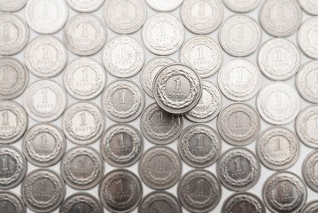 Polish Zloty coins. 1 PLN coin background on the white table.