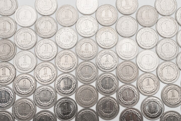 Polish Zloty coins. 1 PLN coin background on the white table.