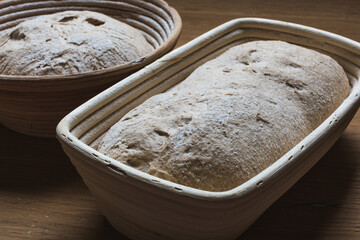 Bread proofing Whole grain dough in rattan baskets before baking Yeast-free sourdough bread - obrazy, fototapety, plakaty