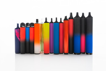 Disposable electronic cigarettes. Set of colorful e-cigarettes of different shapes. Concept of modern smoking.