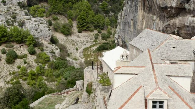 Brick Stone Structures Of Pustinja Blaca Hermitage In Stone Desert, Brac Island, Dalmatia, Croatia. Aerial Drone Shot