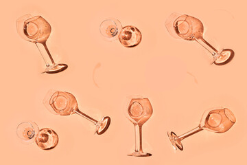 Glasses with wine or champaign on peach fuzz color background. Flat lay. Color of the year. High quality photo