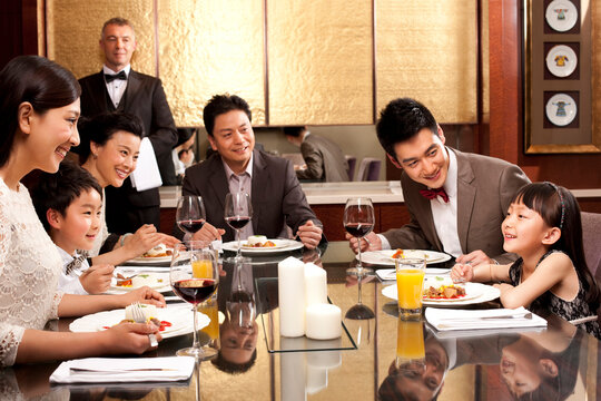 Family having dinner in a luxurious dinning room