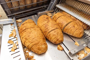 Selbstklebende Fototapeten Freshly baked loaves of bread © Grafvision
