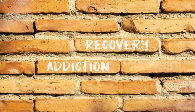 Addiction recovery symbol. Concept words Addiction recovery on beautiful brown brick wall. Beautiful brown brick wall background. Psychology addiction recovery concept. Copy space.