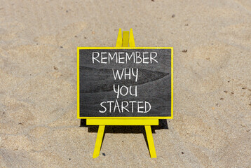 Remember why you started symbol. Concept word Remember why you started on beautiful black chalk...