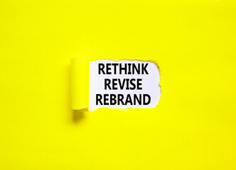 Rethink revise rebrand symbol. Concept word Rethink Revise Rebrand on beautiful white paper. Beautiful yellow table background. Business brand motivational rethink revise rebrand concept. Copy space.