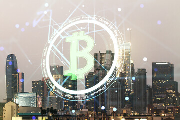 Double exposure of creative Bitcoin symbol hologram on Los Angeles office buildings background....
