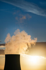 Sunset on the cooling chimney of the boraciferous blowers