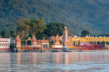 views of rishikesh city crossed by ganges river, india