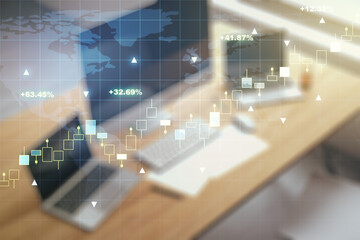 Abstract creative financial graph with world map and modern desktop with pc on background,...
