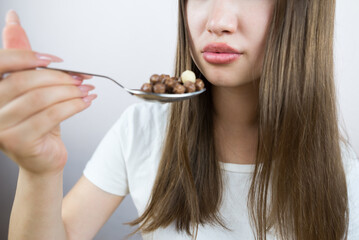 Young woman eating breakfast balls