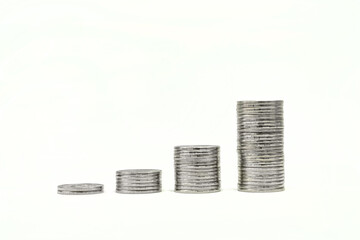 Closeup of stack of silver coins on white background. Money and Financial Concept.