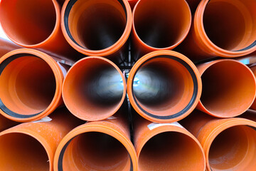 Lots of new orange sewer pipes with gaskets, 100mm.