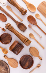 Various kinds of kitchen utensils made of wood eco-friendly materials on a white background. Flat...