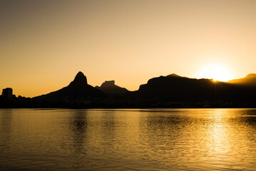 Beautiful View of Rio de Janeiro Sunset Behind Mountains at Rodrigo de Freitas Lake