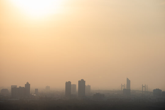 PM 2.5 dust in Bangkok, Thailand. Covered by heavy smog, Misty sunset in downtown with bad air pollution, Bad air pollution in City. Landscape with bad air pollution and Dangerous