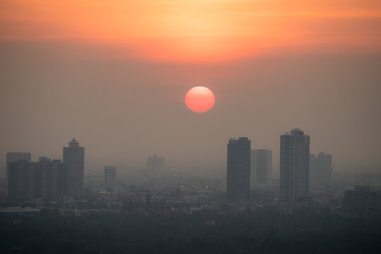 PM 2.5 dust in Bangkok, Thailand. Covered by heavy smog, Misty sunset in downtown with bad air pollution, Bad air pollution in City. Landscape with bad air pollution and Dangerous