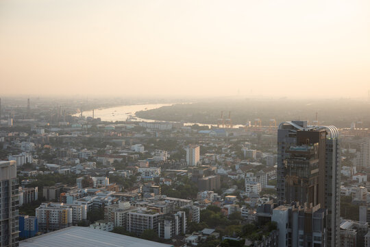 PM 2.5 dust in Bangkok, Thailand. Covered by heavy smog, Misty sunset in downtown with bad air pollution, Bad air pollution in City. Landscape with bad air pollution and Dangerous