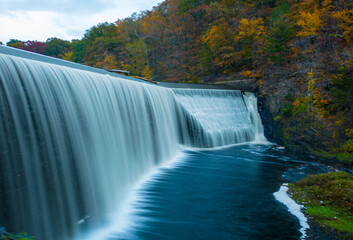 A waterfall in autumn forest. Whitney Water Center. New Haven - obrazy, fototapety, plakaty