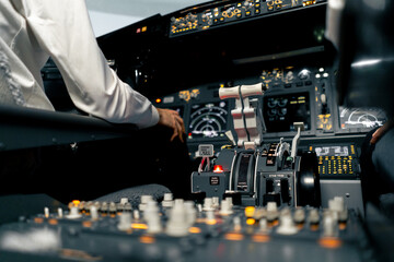 close-up of the cockpit of a passenger plane with many buttons on the control panel of an airplane flight simulator
