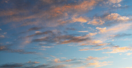 Naklejka na ściany i meble Beautiful bright summer sunset sky with clouds. Nature sky background.