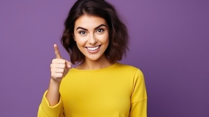A young adorable nice pretty woman wearing a yellow shirt and toothy smile isolated on purple color background,