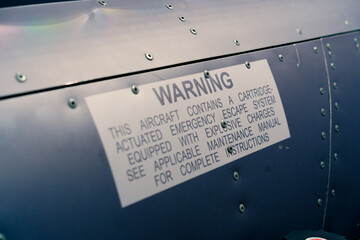 close-up of warning signs on the cockpit of a flight simulator military aircraft
