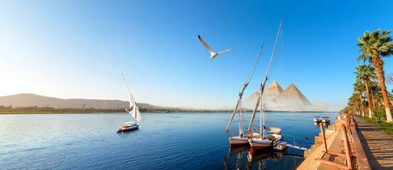Sailboat in Aswan and pyramids - 692000425