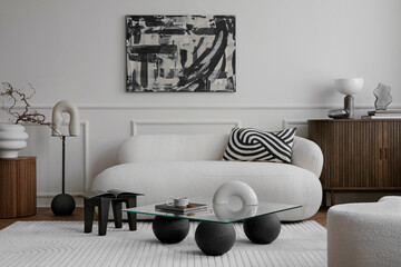 Cozy composition of living room interior with mock up poster frame, glass coffee table, stylish...