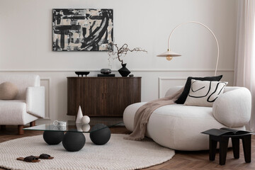 Modern composition of living room interior with mock up poster frame, glass coffee table, stylish sofa, white armchair, wooden sideboard, round rug and personal accessories. Home decor. Template.
