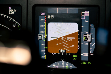 Close-up of an airplane cockpit Center panel with main flight display and navigation display Airplane pilot panels - obrazy, fototapety, plakaty
