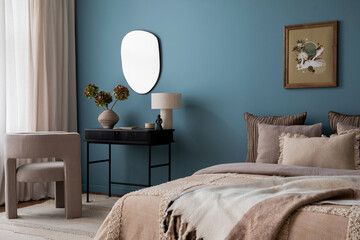 Creative composition of warm bedroom interior with mock up poster frame, blue wall, gray bedding,...
