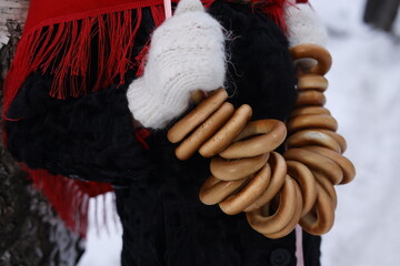 Woman with big braid in brown retro fur coat in winter street with snow. Winter cold weather. Girl...