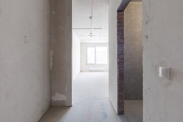 interior of the apartment without decoration in gray colors. rough finish