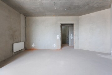 interior of the apartment without decoration in gray colors. rough finish