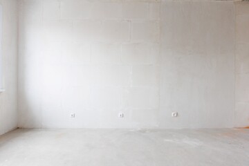 interior of the apartment without decoration in gray colors. rough finish