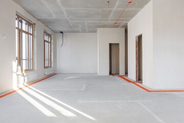 interior of the apartment without decoration in gray colors. rough finish