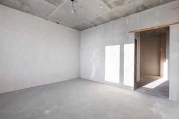 interior of the apartment without decoration in gray colors. rough finish