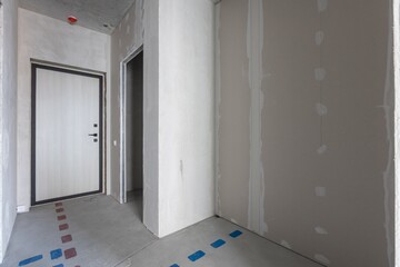 interior of the apartment without decoration in gray colors. rough finish