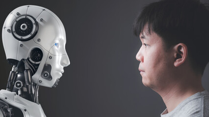 The faces of human and a robot on opposite sides Looking at each other, Modern AI technology...