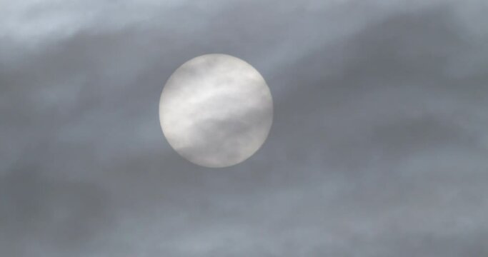 morning sun behide a cloud