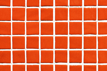 Orange square ceramic tile background. Swimming pool texture. Geometric wall decoration. Home...
